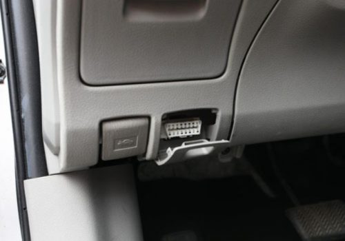 The location of the diagnostic connector in the Volvo car on the left side of the torpedo under the instrument panel. The photo shows a diagnostic connector of a new type (for cars after 1995 of release)